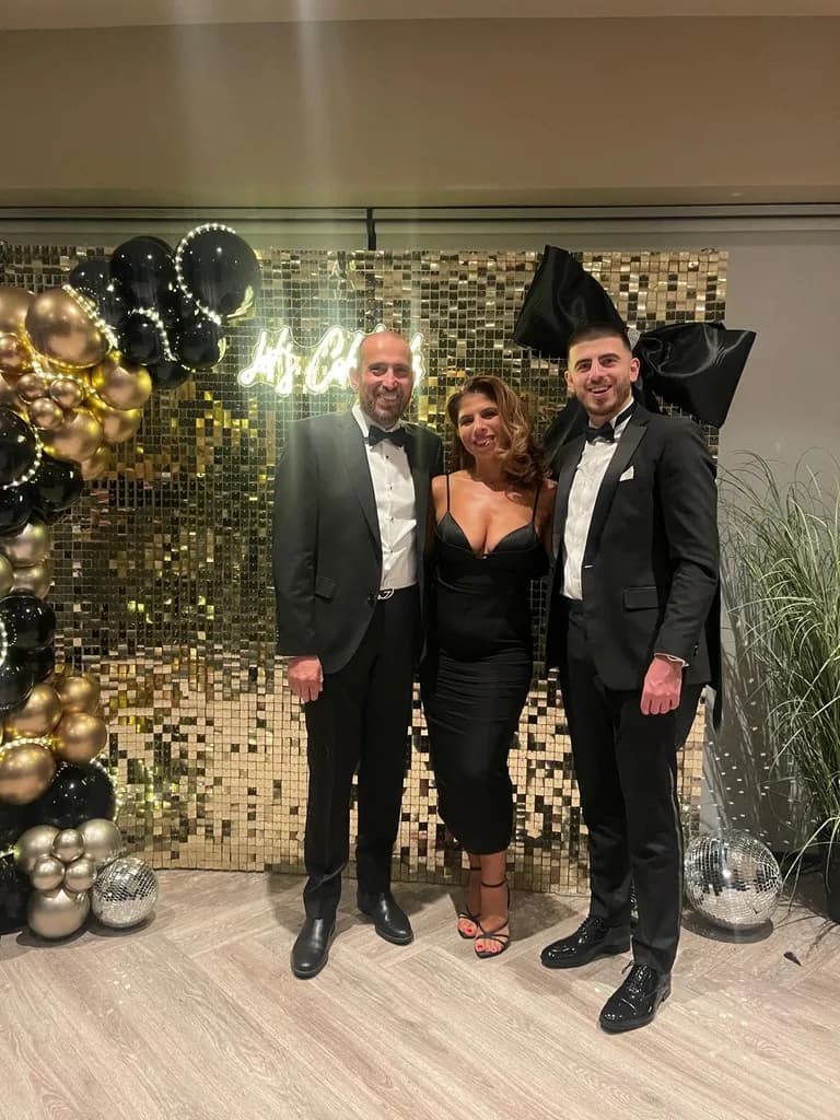 Kaiyan Ali with parents at a black tie evening